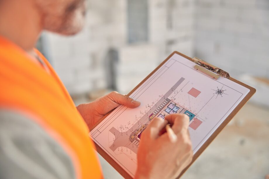 Man making changes to the house plan